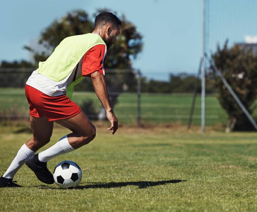 Athlete sprinting on grass