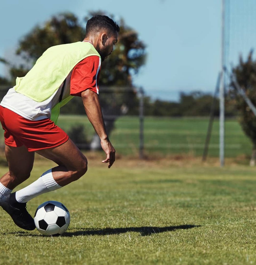 Athlete sprinting on grass