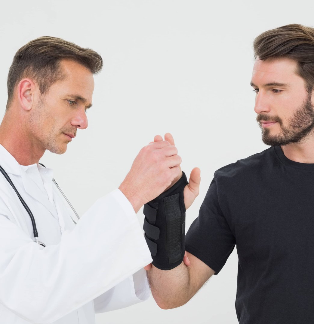 Two men having a discussion in a clinical setting