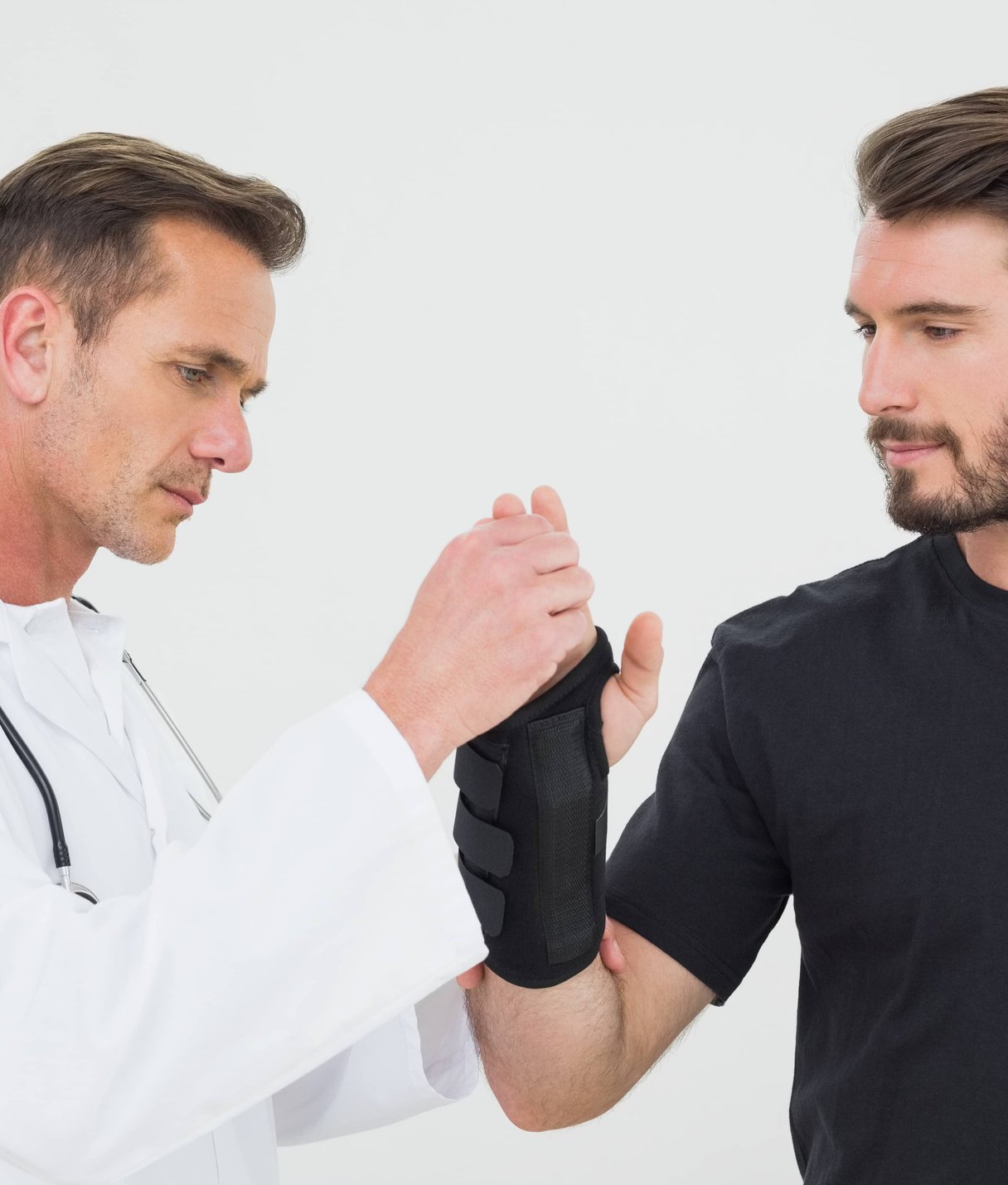 Two men having a discussion in a clinical setting