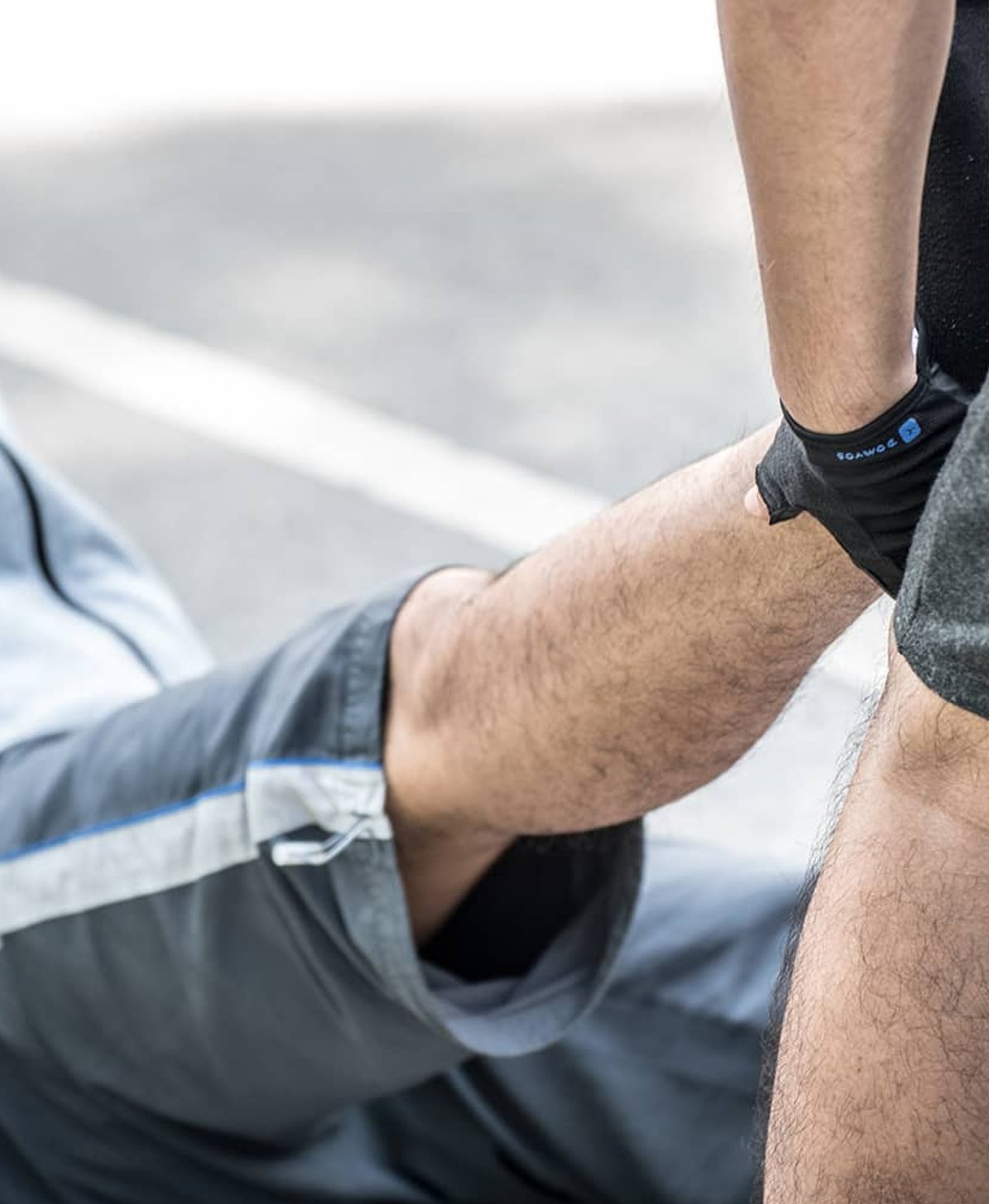 Close-up of therapist applying knee brace